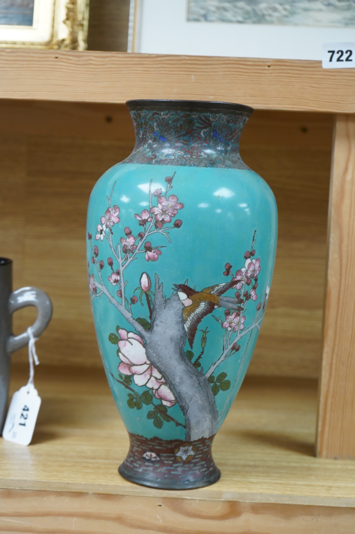 A Japanese cloisonne vase enamelled with birds amongst blossom, 31cm high